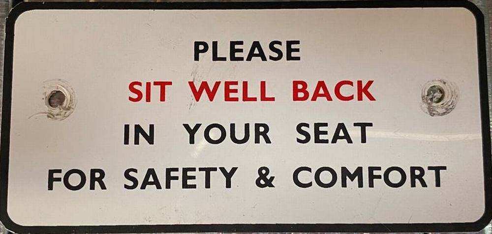 Sign – please sit well back